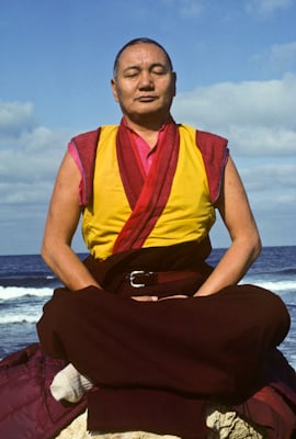 Lama Yeshe meditating by the ocean, Sicily, 1983. Photo: Jacie Keeley.