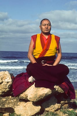 Lama Yeshe meditating by the ocean, Sicily, 1983. Photo: Jacie Keeley.