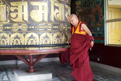 Lama Zopa Rinpoche turns the prayer wheel at Kopan Monastery, Nepal, December 2015. Photo: Bill Kane.  