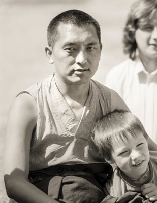 Lama Zopa Rinpoche relaxing with children and students at Waterlow Park, Highgate, London, 1983. Photo by Robin Bath.