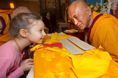 Lama Zopa Rinpoche with a young student, Maitripa College, USA, 2010. Photo: Marc Sakamoto.