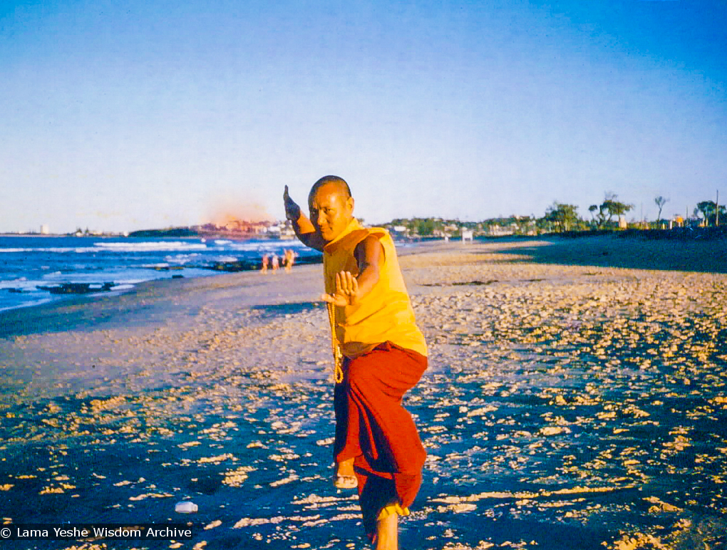 (00079_ud.jpg) Lama Yeshe dancing/debating on the beach after the month-long course at Chenrezig Institute, Australia, 1975. Photo by Anila Ann.