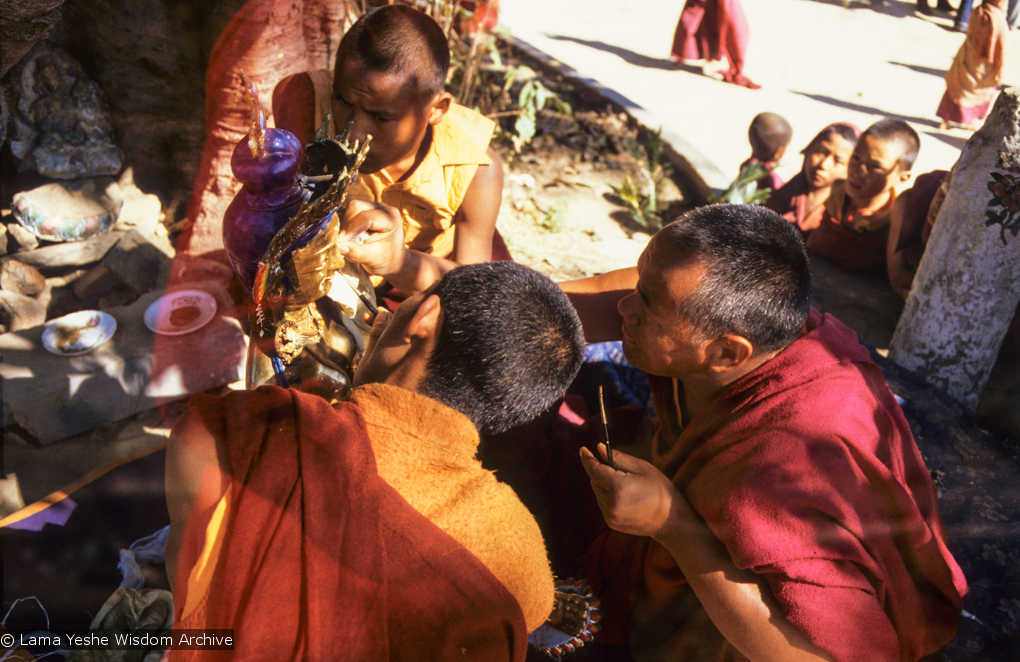 (06479_sl.JPG) Lama Yeshe painting Tara, Kopan Monastery, Nepal, 1976. Lama Yeshe sent Max Mathews to buy a large Tara statue in Kathmandu, which was eventually placed in a glass-fronted house on a pedestal overlooking a triangular pond that was built under the ancient bodhi tree in front of the gompa, Kopan Monastery, Nepal. Photo by Peter Iseli.