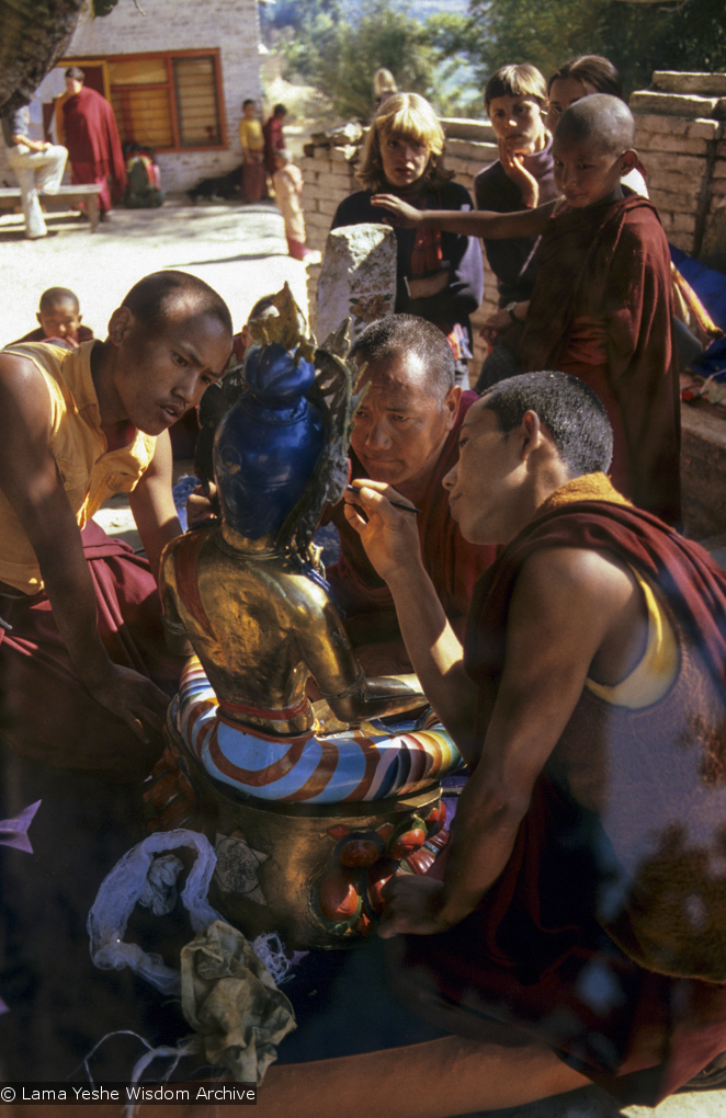 (06486_sl.JPG) Lama Yeshe painting Tara, Kopan Monastery, Nepal, 1976. Lama Yeshe sent Max Mathews to buy a large Tara statue in Kathmandu, which was eventually placed in a glass-fronted house on a pedestal overlooking a triangular pond that was built under the ancient bodhi tree in front of the gompa, Kopan Monastery, Nepal. Photo by Peter Iseli.