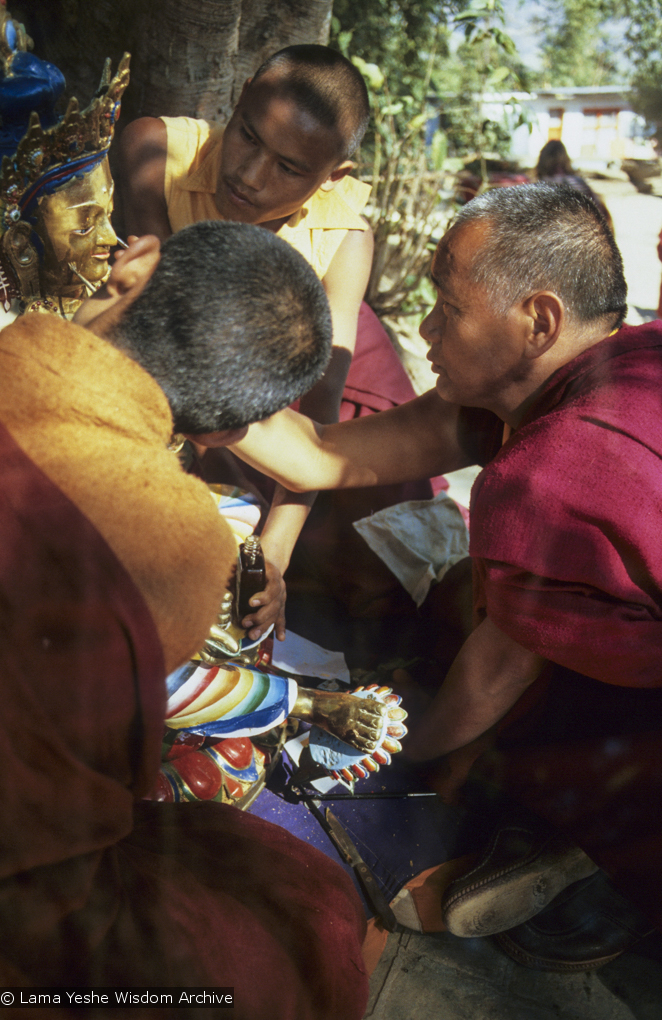 (06489_sl.JPG) Lama Yeshe painting Tara, Kopan Monastery, Nepal, 1976. Lama Yeshe sent Max Mathews to buy a large Tara statue in Kathmandu, which was eventually placed in a glass-fronted house on a pedestal overlooking a triangular pond that was built under the ancient bodhi tree in front of the gompa, Kopan Monastery, Nepal. Photo by Peter Iseli.