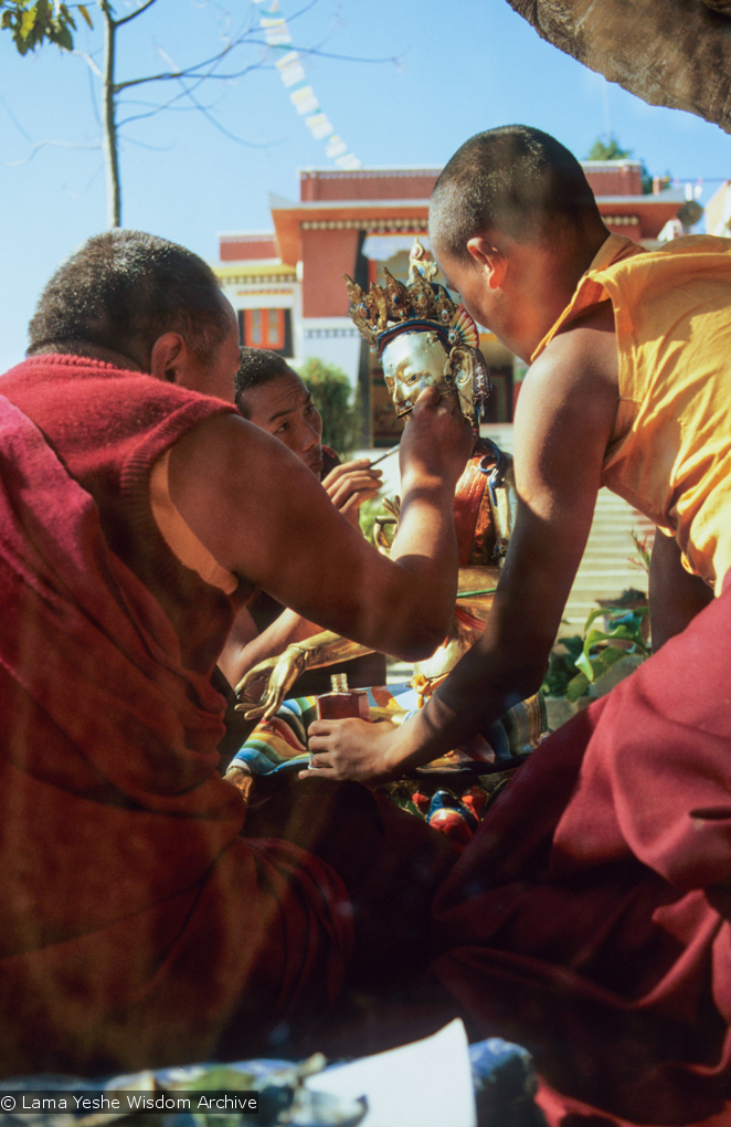 (06490_sl.JPG) Lama Yeshe painting Tara, Kopan Monastery, Nepal, 1976. Lama Yeshe sent Max Mathews to buy a large Tara statue in Kathmandu, which was eventually placed in a glass-fronted house on a pedestal overlooking a triangular pond that was built under the ancient bodhi tree in front of the gompa, Kopan Monastery, Nepal. Photo by Peter Iseli.