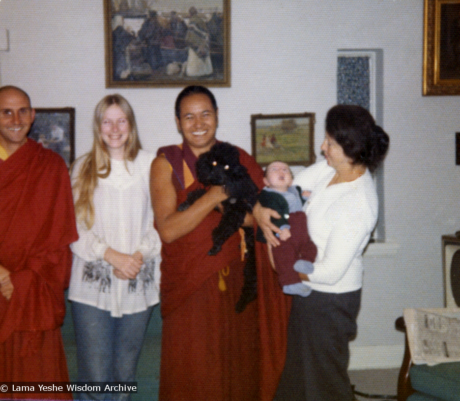 (07647_pr-2.psd) Lama Yeshe with the Ribush family, 1975. From left: Nick Ribush, Alison Ribush, Lama Yeshe holding Bobik, and Beatrice Ribush holding Kalu. Melbourne, Australia, 1975. Photo by Dorian Ribush.