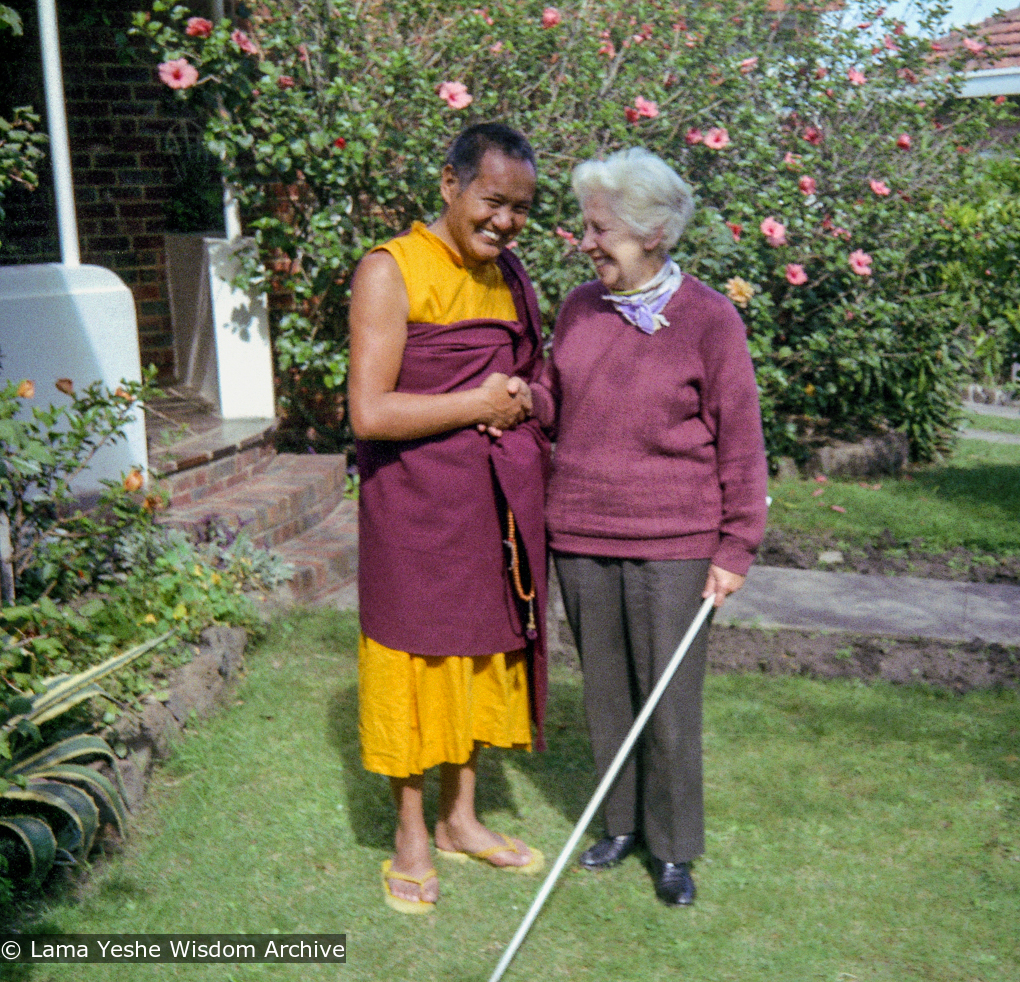 (09309_ng-3.JPG) Lama Yeshe and Myra Slade in the front yard of Beatrice Ribush&#039;s home in Melbourne, Australia, 1979.