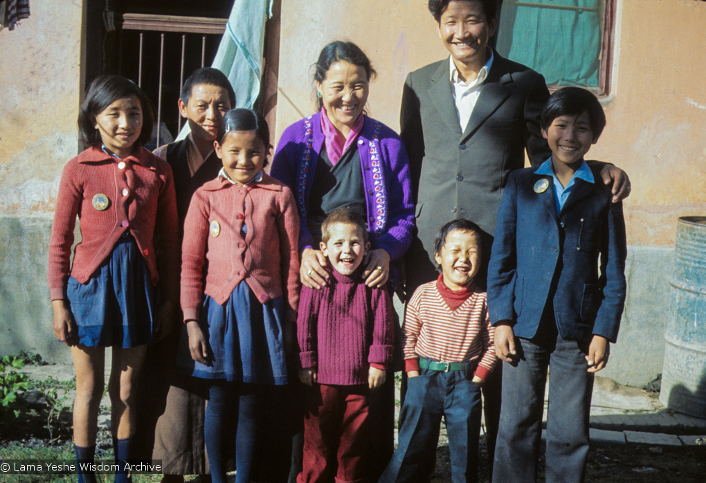 (09626_sl.JPG) Jampa Trinley with his wife, Ngawang, their family and Daja Meston (Thubten Wangchuk) in the front, at their house in Kathmandu, Nepal, 1975. Front row, left to right: Wangmo, Daja Meston (Thubten Wangchuk), Tsewang, Tashi. Back row, left to right: Nyidro, Auntie Tham Chola, Ngawang, Jampa Trinley.   Kelsang Puntsog Rinpoche, the son of Lama Yeshe&#039;s old friend Jampa Trinley, was later recognized to be the reincarnation of Geshe Ngawang Gendun, one of Lama&#039;s teachers.