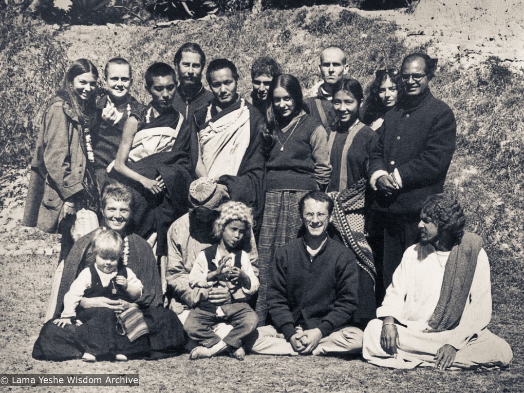 (11006_ud-3.psd) Kopan Group photo from 1970. Tsultrim Allione is second from left in the back row near Lama Zopa. Piero Cerri is in the back row to the right of Lama, looking over his shoulder. At the far right in that row is Madhu. Zina Rachevsky is seated in the front row on the left, holding Rhea. At far right in that row is Zina&#039;s friend, Michel Cerveau, and to his left is Mario Maglietti. (Photo used with permission of the estate of Zina Rachevsky.)