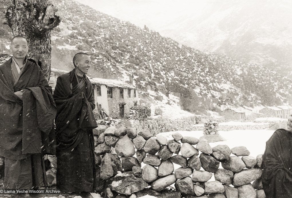 (12029_pr-3.psd) Lama Yeshe (left) and Lama Zopa Rinpoche, with Zina at the far right at Thangme. Photo from the first trek to Lawudo Retreat Center in Nepal, spring of 1969. Lawudo was the hermitage of the Lawudo Lama, the former incarnation of Lama Zopa Rinpoche. Photos by George Luneau.