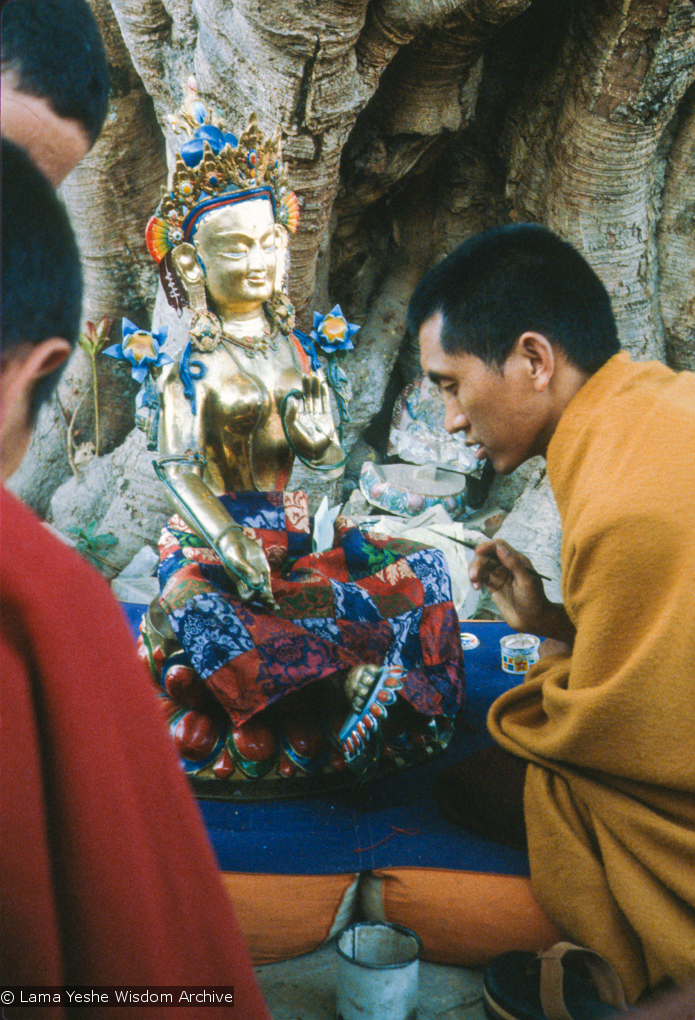 (12930_sl.tif) Lama Zopa Rinpoche painting Tara, Kopan Monastery, Nepal, 1976. Lama Yeshe sent Max Mathews to buy a large Tara statue in Kathmandu, which was eventually placed in a glass-fronted house on a pedestal overlooking a triangular pond that was built under the ancient bodhi tree in front of the gompa, Kopan Monastery, Nepal. Photo by Peter Iseli.