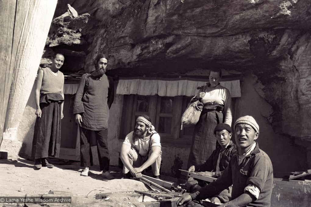(15078_ng-2.psd) Lama Yeshe, Robert and Jesse Sternfield, and Tsultrim Allione with workers outside of the cave of the Lawudo Lama,  Lawudo Retreat Centre, 1970. Photo by Terry Clifford.