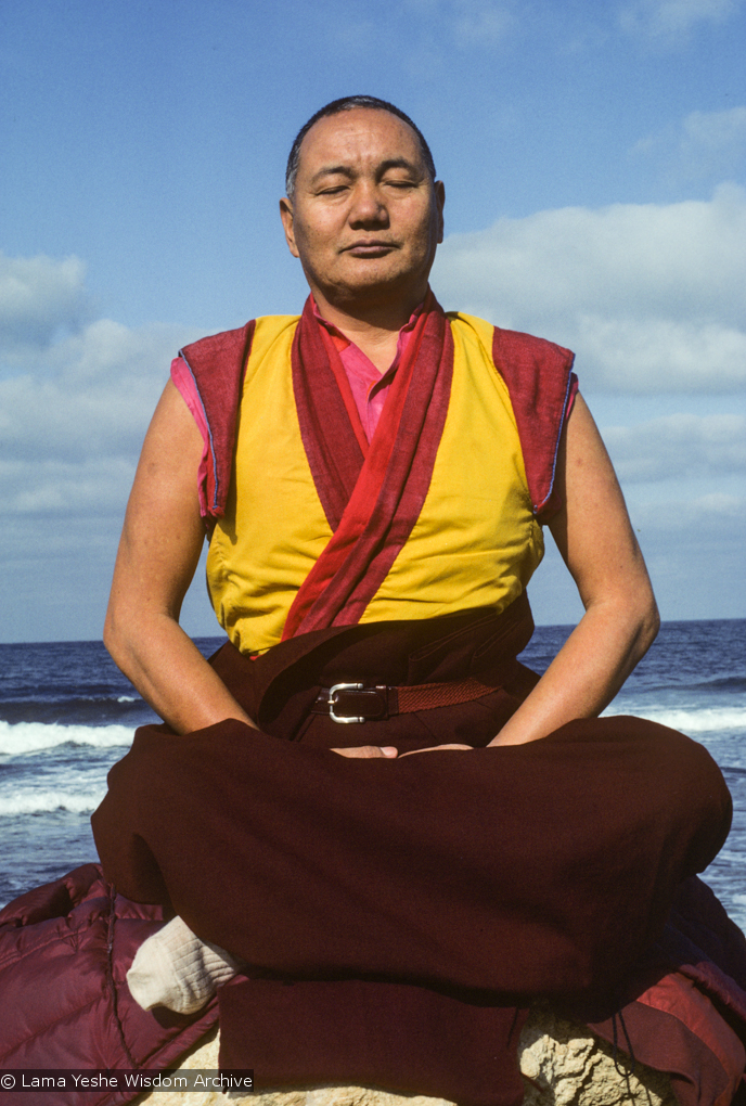 Lama Yeshe meditating by the ocean, Sicily, 1983. Photo: Jacie Keeley