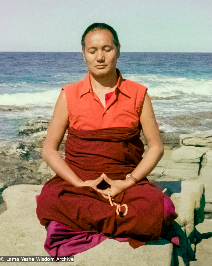 (15849_ng.tif) Lama meditating by the ocean, Maroochydore, Australia, 1974. The lamas took a day off during the Diamond Valley course to go to the beach in Tom Vichta&#039;s van. Everyone got out to enjoy the view from the cliffs, but Lama Yeshe ran straight down to the water&#039;s edge, hitched up his robes, and waded in, splashing about with delight.