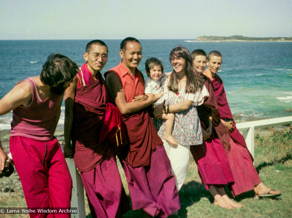 (15852_ng.tif) Group photo by the ocean, Maroochydore, Australia, 1974. The lamas took a day off during the Diamond Valley course to go to the beach in Tom Vichta&#039;s van. Everyone got out to enjoy the view from the cliffs, but Lama Yeshe ran straight down to the water&#039;s edge, hitched up his robes, and waded in, splashing about with delight.