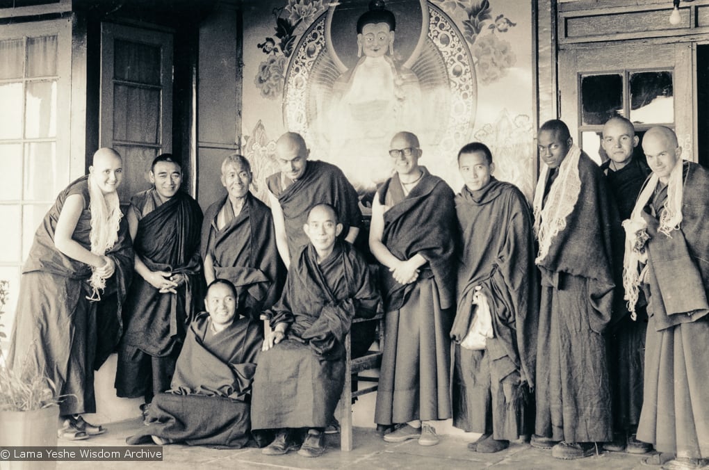 (15904_ud.tif) Ordination group, Tushita, 1975. From left to right: Bonnie Rothenberg, Geshe Jampa Wangdu, unknown monk, John Feuille, Dieter Kratzer, unknown monk, Jampa Konchog (Yogi), Bruno LeGuevel, and Jeffery Webster in the back row, with Lama Yeshe in front (seated)and Lati Rinpoche (seated in chair). On the morning of March 12th with Lati Rinpoche presiding, five new monks and one nun were ordained into the International Mahayana Institute. Tushita Retreat Centre, Dharamsala, India, 1975.