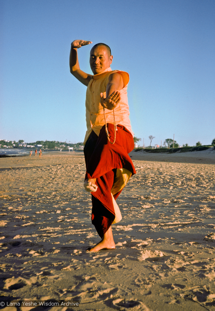 (15924_sl.psd) Lama Yeshe dancing/debating on the beach after the month-long course at Chenrezig Institute, Australia, 1975. Photo by Anila Ann.