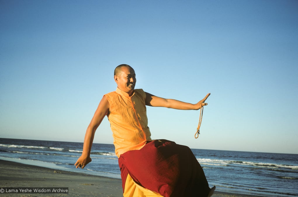 (15925_sl.tif) Lama Yeshe dancing/debating on the beach after the month-long course at Chenrezig Institute, Australia, 1975. Photo by Anila Ann.