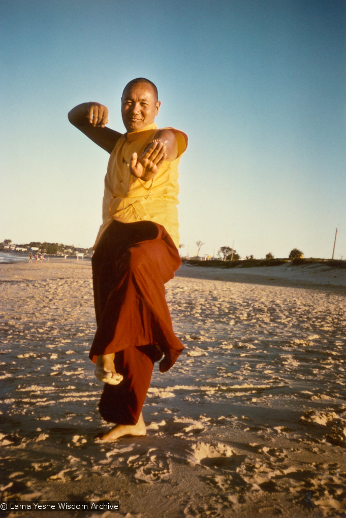 (15928_pr.psd) Lama Yeshe dancing/debating on the beach after the month-long course at Chenrezig Institute, Australia, 1975. Photo by Anila Ann.