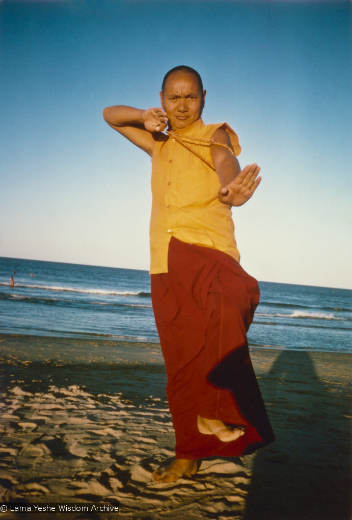 (15930_pr.psd) Lama Yeshe dancing/debating on the beach after the month-long course at Chenrezig Institute, Australia, 1975. Photo by Anila Ann.