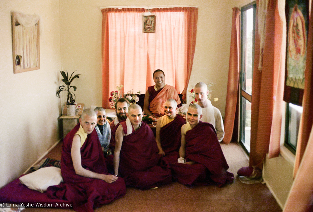 (16744_ng-3.psd) Lama Yeshe with new Sangha at rabjung ordination, Chenrezig Institute, Australia, 1976. From the left: Nigel, unknown woman,  Uldis Balodis (with beard), Charlie Topp (front center), Helen McCallum (Yeshe Dorje), and Tony Duff (right front). Behind Tony is Terry O&#039;Neil. Lama  Yeshe is seated in the back.