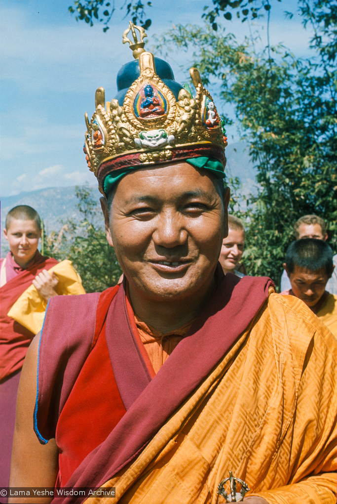 (16769_sl.tif) Lama Yeshe wearing a ceremonial crown of the five dhyani buddhas for the Tara statue procession, Kopan Monastery, Nepal, 1976. Behind him is Yeshe Khadro (Marie Obst) on the left and Wendy Finster and  Ngawang Khyentse on the right.