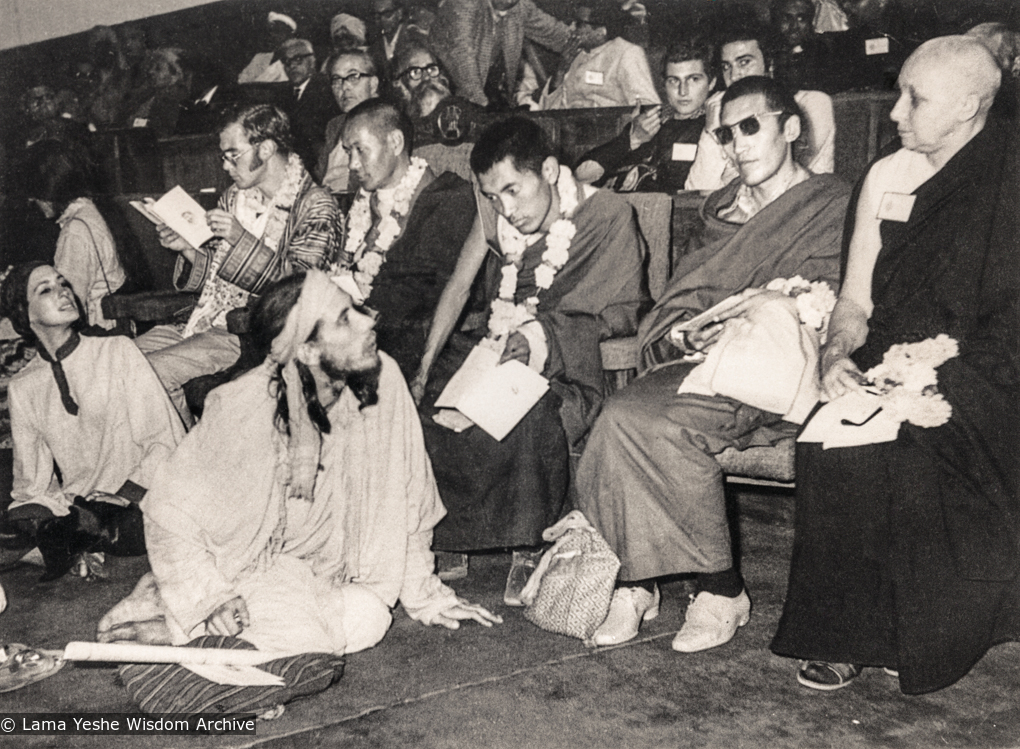 (18782_pr-3.psd) Lama Yeshe&#039;s first public speaking engagement at the International Yoga Conference in Delhi, India, 1970. Lama Zopa Rinpoche is in the centre, Lama Yeshe is to the left, Freda Bedi is at far right. On the far left is Terry Clifford. In the row behind the lamas is Piero Cerri and Claudio Cipullo.