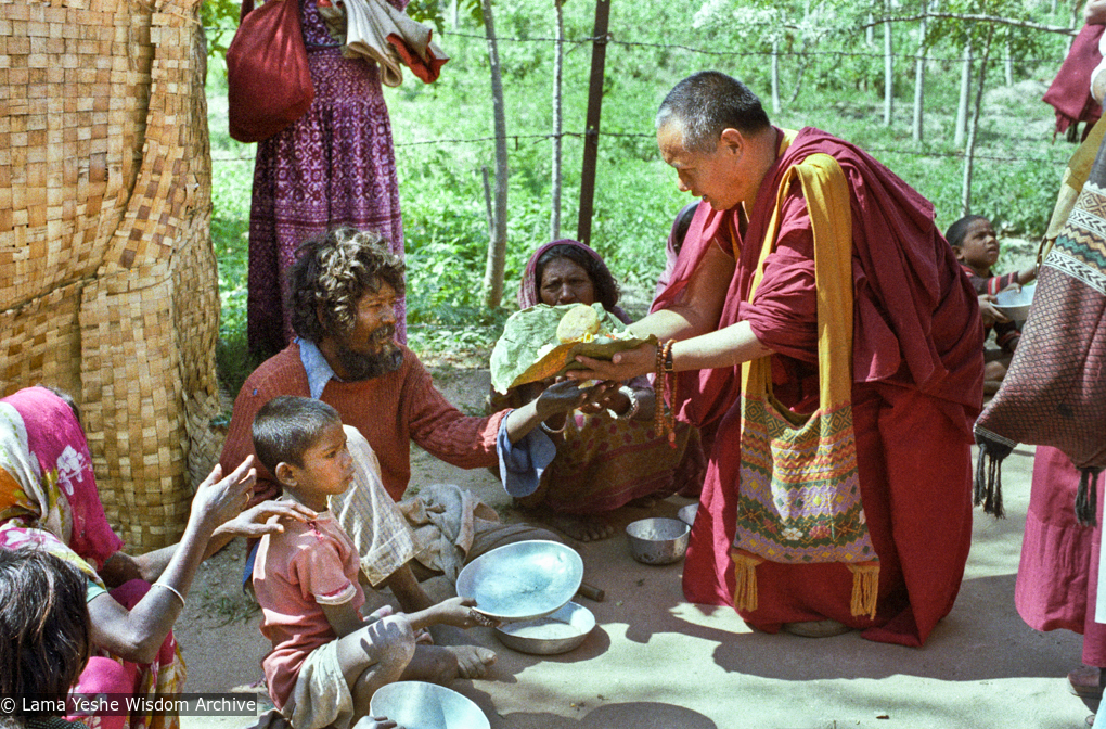 (23283_ng-3.psd) Beggars&#039; banquet, Bodhgaya, India, 1982. Lama Yeshe feeding people on the street.