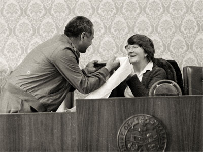 Lama Yeshe presents book and khata to Elaine McNamara, president of Marong shire, Victoria, Australia, 1981. 