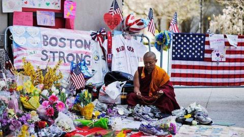 Geshe Tenley, from FPMT's Kurukulla Center, participating in public prayers after the Boston Marathon explosion in April 2013.