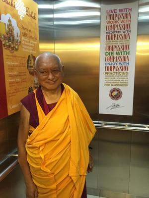 Rinpoche in the elevator at Amitabha Buddhist Centre, Singapore, March 2016. Photo: Roger Kunsang.