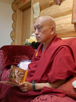 Lama Zopa Rinpoche writing cards at Buddha Amitabha Pure Land, USA, October 2016. Photo: Holly Ansett.