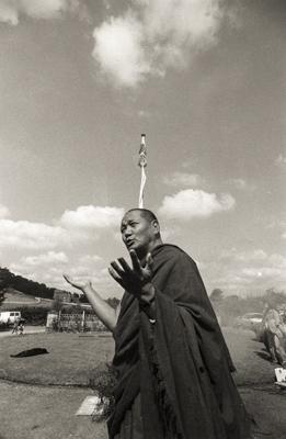 Lama Yeshe at an outdoor puja  to celebrate the end of the first year of a geshe studies course, Manjushri Institute, England, 1979.
