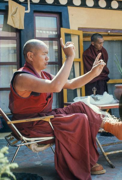 Lama Yeshe enacts a ritual dance on the gompa terrace at Kopan Monastery, Kathmandu, Nepal, 1978.