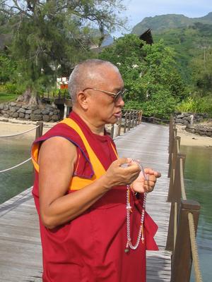 Lama Zopa Rinpoche blessing sentient beings in the water, Tahiti, March 2004.