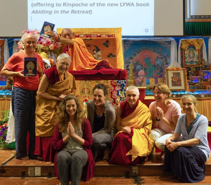 LYWA staff present Abiding in the Retreat book to Lama Zopa Rinpoche, North Carolina, 2017. Photo: Ven. Sherab.