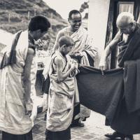 Zong Rinpoche shows Losang Tseten how to wear a zen, Kopan, 1974