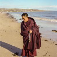 Lama Zopa Rinpoche at the beach, 1983