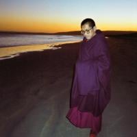 Lama Zopa Rinpoche at the beach, 1983