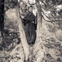 Lama Zopa in a tree, Lawudo, 1972