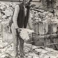 Chowkidhar fixing the exploded septic tank