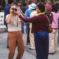Lama with camera, China, 1982