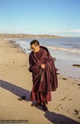 Lama Zopa Rinpoche at the beach, 1983