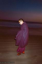 Lama Zopa Rinpoche at the beach, 1983