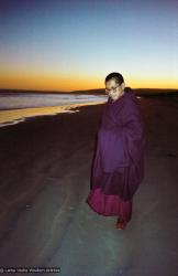 Lama Zopa Rinpoche at the beach, 1983