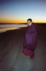 Lama Zopa Rinpoche at the beach, 1983
