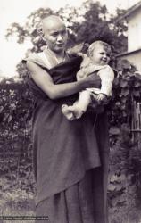 Lama Yeshe holding Zina's daughter, Rhea, in Darjeeling, 1967
