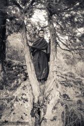 Lama Zopa in a tree, Lawudo, 1972