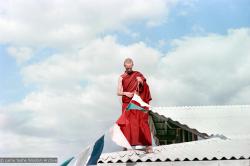 Jhampa attaching prayer-flags, CIN, 1976